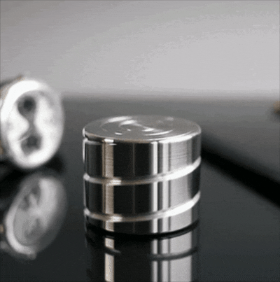 Silver Zenklar Axis kinetic desk tool positioned for a moment of mental reset and clarity 