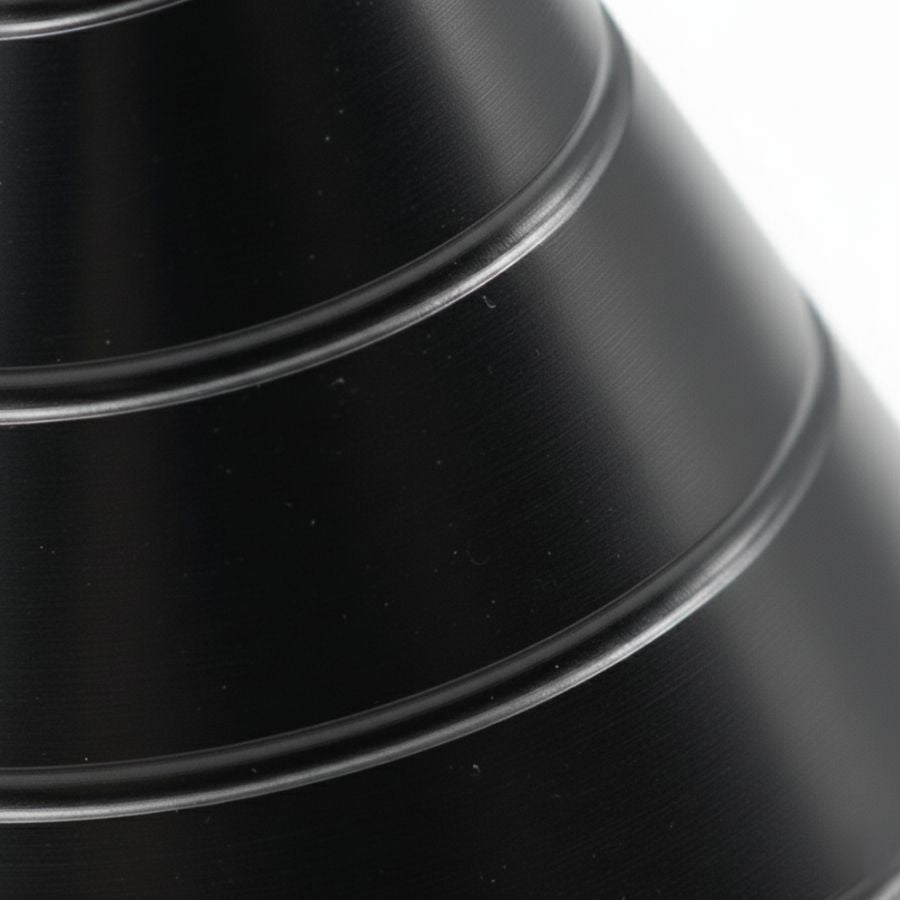 Close-up detail of the spiral surface design on the Zenklar Vortex kinetic focus tool