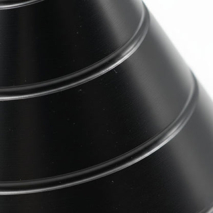 Close-up detail of the spiral surface design on the Zenklar Vortex kinetic focus tool